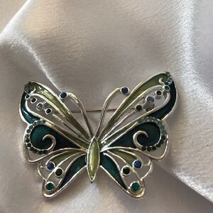 Butterfly brooch in green and‎ teals on silver